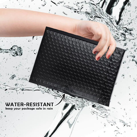 Hand holding Black Waterproof Bubble Mailers 4x8 Self Seal Adhesive Shipping Bags, 200 Pack Cushioned Padded Envelopes