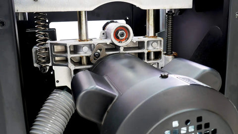 Workhorse Cabinet Tablesaw Boasting A Beefy 7.5Hp Motor Integrated Dust Collection Gear And Factory Fresh Blade close-up of the motor and dust collection system.