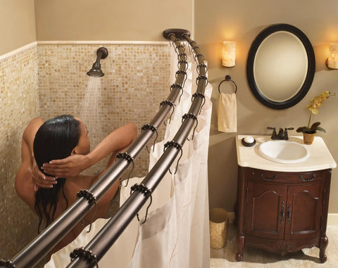 Oil-Rubbed Bronze Posi-Temp Bath And Shower Trim Kit in use with traditional showerhead and arm, bathroom setting.