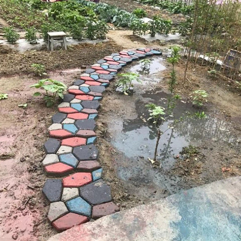 Reusable Concrete Walkway Mold For Paving Pavement Stepping Stone Pavers Large Size DIY Friendly Easy To Use Durable Polypropylene Cement Molds For Patio Lawn Garden Paths showing colorful stepping stones in garden path.