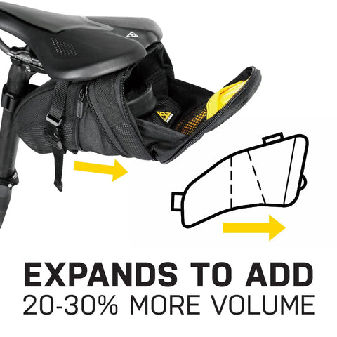 Aero Wedge Pack With Strap Mount For Bike Seat Post showing expansion feature and storage under saddle.