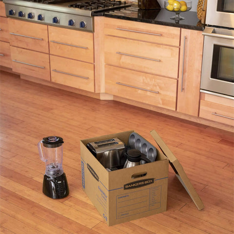 Solid Gear Medium Moving Boxes 20 Pack With Tapeless Assembly And Reinforced Carry Handles in kitchen with appliances inside.