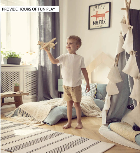 Child playing with toy airplane from Wooden Airplane Model Kit 4 Pack Water Plane Spirit Of St Louis Nieuport 17 Tri Plane 3D Puzzles