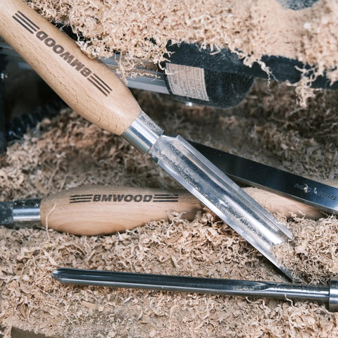 Cryo Treated M2 High Speed Steel Roughing Gouge Three Quarter Inch in shavings with beech handle and stainless bolster.
