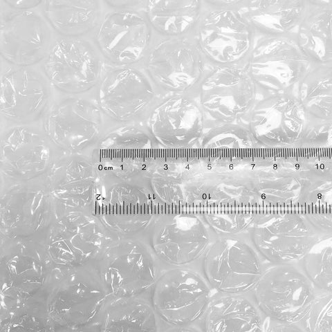 Kick Your Packing Game Up A Notch With This Heavy Duty Bubble Cushioning Wrap Perfect For Shipping Storage Or Moving Clear Perforated Rolls That Keep Fragile Gear Secure, showcasing 8mm bubbles and a ruler for size reference.