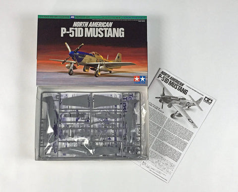 Box and contents of One Seventy Two Scale Dope P Fifty One D Mustang Model Kit With Detailed Panel Lines Ready To Assemble Static Display Aircraft Includes Markings For Three WWII US Fighters And Realistic Recessed Detailing.