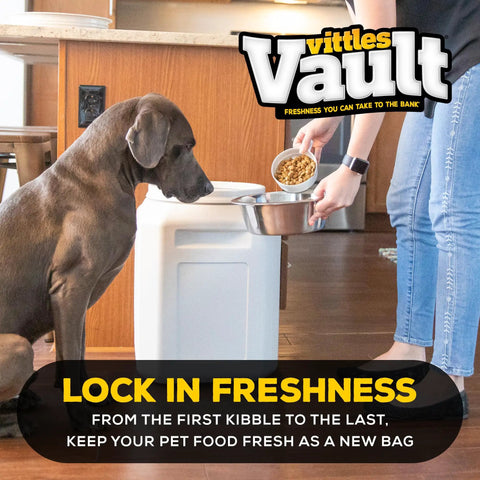Person using Pet Food Storage Container With Airtight Seal Keeps Dry Kibble Fresh For Dogs And Cats Up To Fifty Pounds Pest Proof Lid Made In USA Large Fourteen By Twenty Inch Pantry Canister to fill dog bowl
