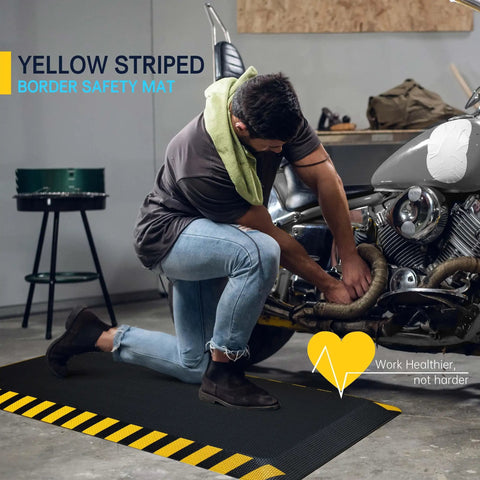 Industrial Anti Fatigue Mat For Standing Workstations, Ultra Comfy Ergonomic Floor Pad With High Density Memory Foam, Leg And Back Pain Relief, 20 By 39 Inches, Yellow Border, 1 Piece, in garage use with motorcycle.