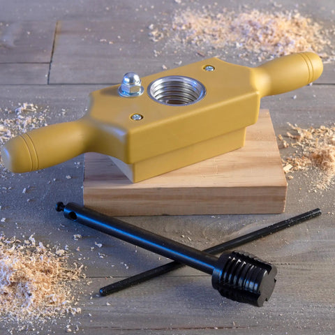 Pro Grade Tap And Die Set 1-1/4 Inch Wood Thread Kit with two-handed thread box and bottoming tap on wooden surface