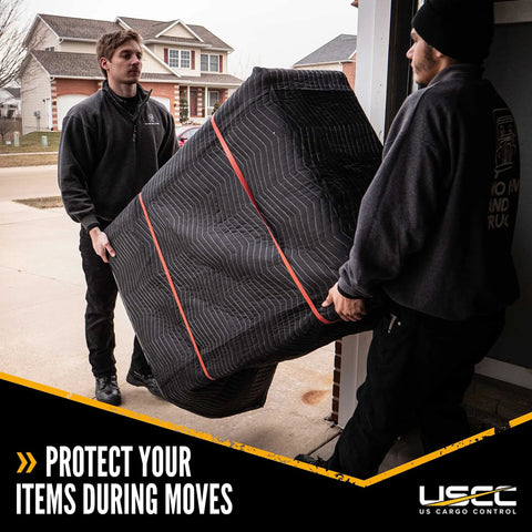 Two movers carrying a protected item wrapped in Heavy Duty Moving Blankets 80 by 72 Inches 4 Pack Quilted Furniture Pads Cotton Polyester.