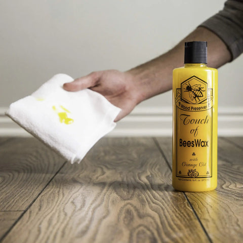 Beeswax Wood Polish And Restorer Bundle For Hardwood Floors, All In One Cleaner And Conditioner Spray With Real Orange Oil bottle on floor