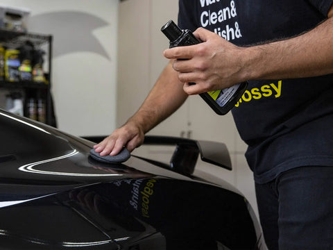 Person using All In One Car Wax Cleaner That Cleans Dirt Grime And Water Spots, Removes Light Scratches On car surface.