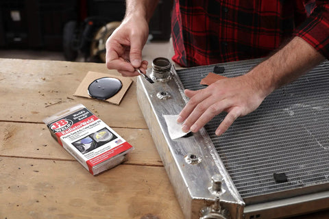 Man using Radiator Repair Kit For Plastic Tank Leak Fix And Permanent Pro Grade Cooling System Repairs With Easy To Follow Instructions And Durable Components Now on radiator