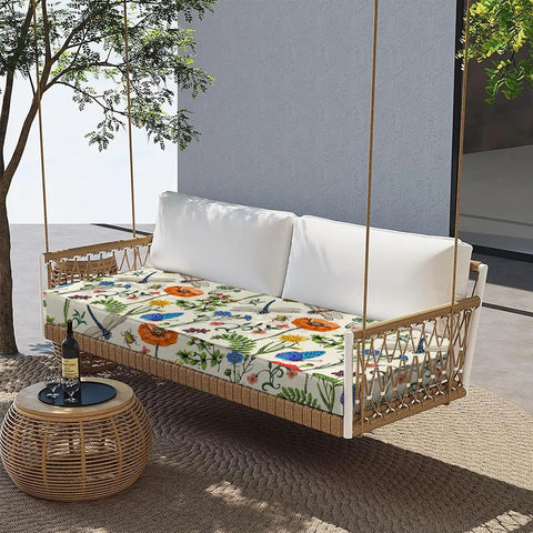 Outdoor Bench Cushion With Ties 42 Inch By 18 Inch Waterproof Polyester Cover on a porch swing with floral pattern under a tree.