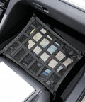 Ceiling Cargo Net With 3 Pockets And Double Layer Mesh Overhead Storage Organizer For Cars And SUVs used for floor storage inside vehicle.