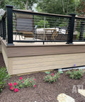 Garden view of deck with black railing using Swivel End Fittings For Cable Railings Five Thirty Second Inch 316L Marine Grade Stainless Steel Ten Pack.