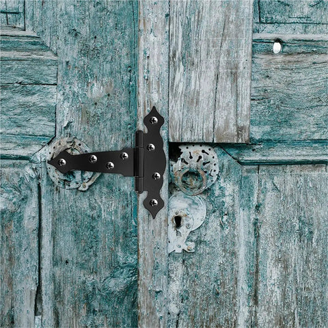 Durable T Shaped Barn Door Hinges Iron Hardware Kit For Gates And Fences 6 Inch 2 Pack mounted on rustic door