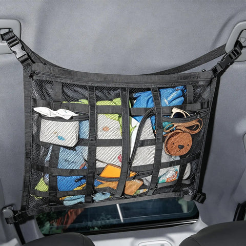 Ceiling Cargo Net With 3 Pockets And Double Layer Mesh Overhead Storage Organizer for cars and SUVs, filled with items.