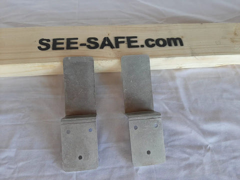 Heavy Duty Drop Open Bar Sliding Barn Door Lock Jammers With Tough As Nails Z Brackets Fits Standard 2x4 Boards Rock Solid Marine Grade Aluminum Pair on a wooden surface.