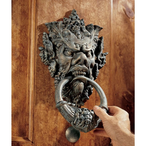 Hand using Vecchio Greenman Authentic Iron Door Knocker In Verdigris Hand Finished Cast Iron With Vintage Bronze Look Rustic Home Accent