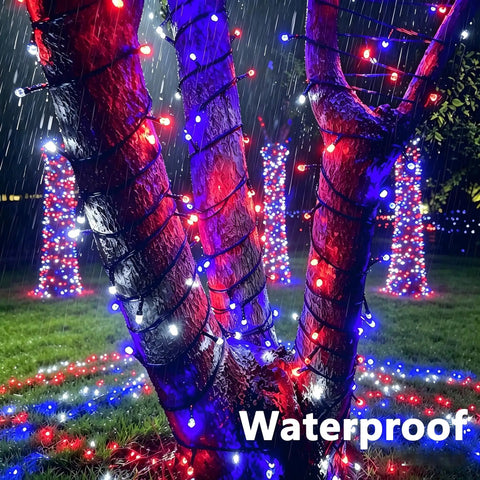 Waterproof 164Ft 500LED RGB String Lights Outdoor with Remote Timer Memory on tree during rain with patriotic colors.