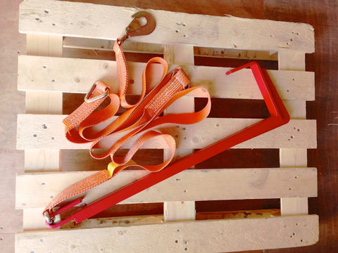 Heavy Duty Pallet Puller Bar With Three Point Seven Meter Strap Designed For Forklifts with rugged steel hook on wooden pallet.