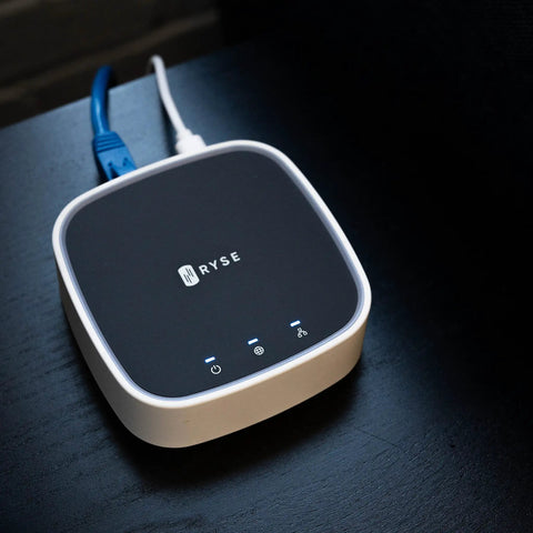 Smart Bridge For Window Shades 2025 Edition Connects With Alexa, Google Home, And Apple HomeKit device on a table.