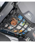Ceiling Cargo Net With 3 Pockets And Double Layer Mesh Overhead Storage Organizer for cars and SUVs installed with items visible