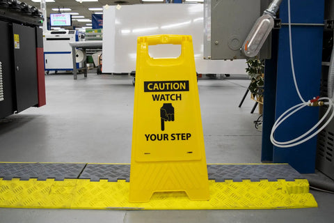 Heavy Duty Double Sided Watch Your Step Caution Sign For Job Sites And Warehouses Non Slip Floor Decal in bright yellow.