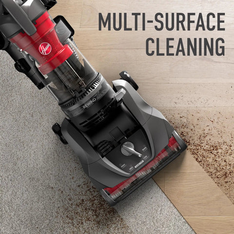Hoover Rewind Pet Upright Bagless Vacuum Cleaner For Carpet And Hard Floors With Automatic Cord Rewind And Above Floor Cleaning Capability In Sleek Gray Finish cleaning dirt on carpet and hardwood floor.