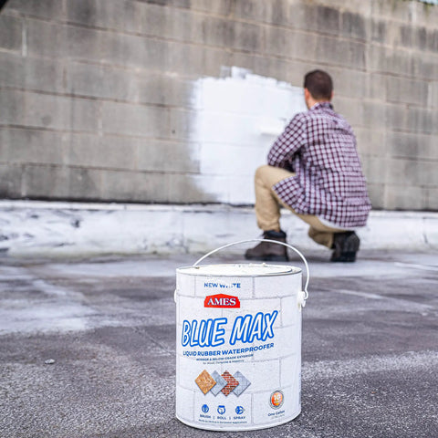 Built Tough Liquid Rubber Waterproofing Coating For Concrete Foundations And Basements Rock Solid Elastomeric Sealant That Fully Shuts Out The Damp Bulletproof One Gallon Container in use on wall.