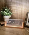 Custom Name And Title Desk Name Plate With LED Light Wood Holder For Dentist Doctor Hygienist Nurse Front Desk Sign Plaque Custom Engraving For Office Decor And Pro Gift shown with engraving and lit base.