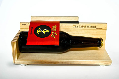 Heavy Duty Manual Bottle Labeler For Wine Beer And Jars Guarantees Straight Up Flawless Alignment Every Single Day with a bottle and label.