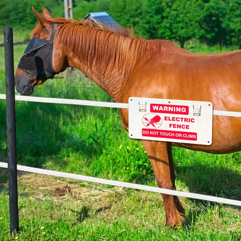 15 Piece Electric Fence Warning Signs No Touching Electric Safety Sign To Protect Your Farm Home 9.68 By 5.04 Inches White And Red Pack Of 15 Durable Signs With Mounting Holes And Lugs installed on a fence beside a brown horse.