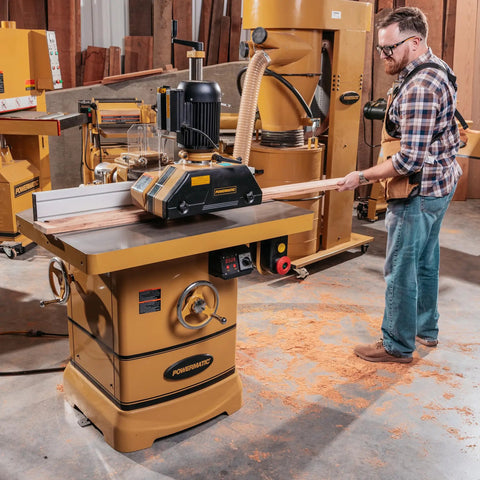 Rock Solid Shop Beast Five Horsepower Spindle Shaper With Massive Cast Iron Bed Digital Depth Gauge And Butter Smooth Fence Adjustments For Pro Level Woodcraft, heavy-duty spindle shaper in workshop.