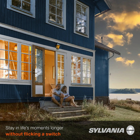 Auto On Off Dusk To Dawn A19 LED Bulb With Light Sensor, 60W Equivalent, illuminating porch of blue house at dusk, 1 pack