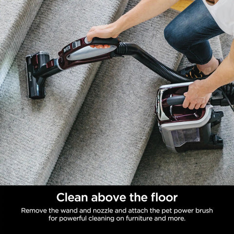User cleaning stairs with Shark Rotator Powered Lift Away TruePet Upright Vacuum With Hepa Filter, pet power brush attachment.