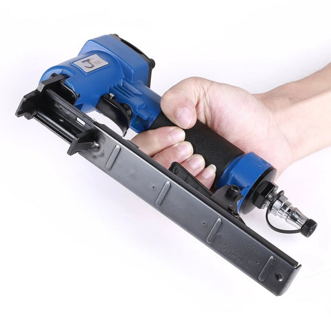 Heavy Duty 14 Gauge Brad Nailer With Touch Strike Safety Adjustable Exhaust, held in hand, featuring a die cast aluminum body and comfort grip.