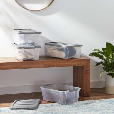 Heavy Duty Plastic Storage Containers With Secure Latching Lids Stackable Organization Bins Clear Grey Totes 12 Quart Gear Haulers Set Of 6 on a wooden bench.