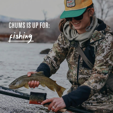 Person holding fish and Surfshorts Wallet Slim Card Holder With RFID Blocking on a fishing trip