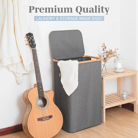 Breathable Fabric Laundry Hamper With Lid, Bamboo Frame, Side Handles, 26 Gallon Gray Go-To Laundry Basket in room setting