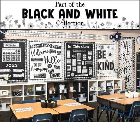 Classroom with black and white themed decor, including motivational posters and organized shelves, reflecting a welcoming environment.