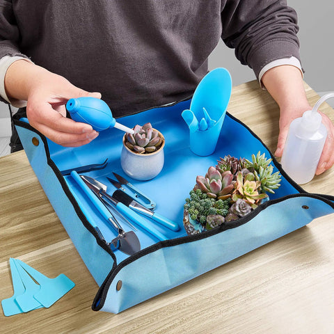 Person using Dope Succulent Tools 19 Piece Mini Garden Tool Set For Transplanting And Plant Care With Potting Tarp Mat Indoor Outdoor Kit