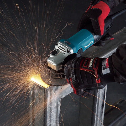 Powerful 4-1/2 Inch Angle Grinder With Kick Butt Strength cutting metal, sparks flying, ergonomic grip, lightweight build.