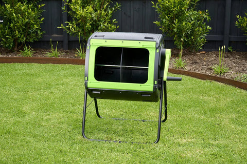48 Gallon Geared Dual Chamber Compost Tumbler With Large Fill Openings Elevated Design To Fit Included Compost Cart Easy Turn Gear Handle And Built In No Fuss Easy Emptying For Quick Odor Free Recycling on lawn