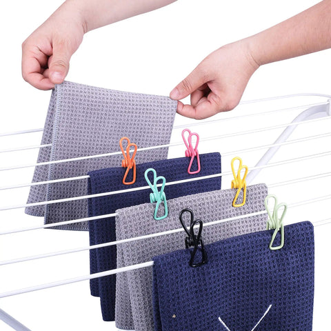 Dope Assorted Bag Clips Set, Solid 30 Pack PVC Food Sealer holding towels on a drying rack in various colors.