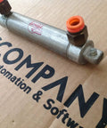 Built Tough Original Line Double Acting Pneumatic Cylinder With Air Return And Pivot Mount offering a solid one one sixteenth inch bore plus three inch stroke for heavy duty gear on cardboard background.