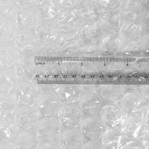 Kick Your Packing Game Up A Notch With This Heavy Duty Bubble Cushioning Wrap Perfect For Shipping Storage Or Moving Clear Perforated Rolls That Keep Fragile Gear Secure showing clear 8mm bubble size with ruler for scale.