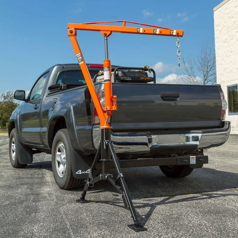 Straight Up Heavy Duty Hitch Mounted Jib Crane For Pickup Trucks Full 360 Rotating Hydraulic Lift Hoist with adjustable legs in a truck bed.