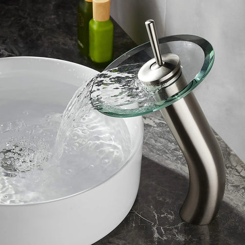 Waterfall Glass Spout Bathroom Faucet With Single Handle Solid Brass Lavatory Vessel Sink Vanity Tap Built To Last In Brushed Nickel Finish Tall Design For A Slick Modern Bathroom Upgrade flowing into a white sink.